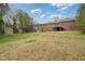 Large backyard with lawn, shed, and deck with stairs at 3355 Lauada Dr, Douglasville, GA 30135