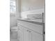 Bathroom vanity features white cabinets, granite countertop, and a decorative faucet at 3355 Lauada Dr, Douglasville, GA 30135