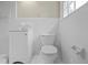 Bright white bathroom with a toilet, vanity, and tub at 3355 Lauada Dr, Douglasville, GA 30135