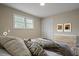 Bedroom with natural light, light colored walls and light wood floors at 3355 Lauada Dr, Douglasville, GA 30135