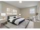 Modern bedroom features a king bed, stylish decor, and neutral tones that create a relaxing ambiance at 3355 Lauada Dr, Douglasville, GA 30135