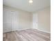 Bedroom with closet, light colored walls and light wood floors at 3355 Lauada Dr, Douglasville, GA 30135