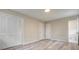 Bedroom with closet and view of bathroom with toilet. Light colored walls and light wood floors at 3355 Lauada Dr, Douglasville, GA 30135