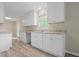 Newly renovated kitchen with modern white cabinets and granite countertops at 3355 Lauada Dr, Douglasville, GA 30135