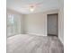 Bright, open living area featuring wood floors and access to an outdoor deck area at 3355 Lauada Dr, Douglasville, GA 30135