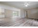 Bright open living room with wood floors and views into the dining area and kitchen at 3355 Lauada Dr, Douglasville, GA 30135