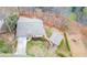 Expansive aerial view of the property, showcasing a well-maintained home, lush greenery, and a long driveway at 5995 Lanier Heights Cir, Buford, GA 30518