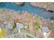An aerial view shows the home, fire pit, and lake frontage at 5995 Lanier Heights Cir, Buford, GA 30518