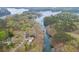 An aerial view shows the home tucked at the end of a serene cove at 5995 Lanier Heights Cir, Buford, GA 30518