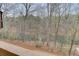 This back deck looks out onto the waterfront with a lovely view of the lake at 5995 Lanier Heights Cir, Buford, GA 30518