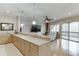 Spacious bar area overlooking the living area, featuring barstool seating and ample countertop space at 5995 Lanier Heights Cir, Buford, GA 30518