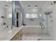Bathroom with a soaking tub, walk-in shower, and large vanity mirror at 5995 Lanier Heights Cir, Buford, GA 30518