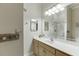 Bright bathroom featuring a large mirror, spacious vanity, and a clean, well-lit shower at 5995 Lanier Heights Cir, Buford, GA 30518