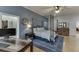 Bedroom with a four-poster bed, soft blue walls, and access to a walk-in closet at 5995 Lanier Heights Cir, Buford, GA 30518