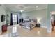 Large bedroom features natural light, hardwood floors, TV, sitting area, and ample closet space at 5995 Lanier Heights Cir, Buford, GA 30518