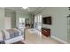 A spacious bedroom with hardwood floors and a large sliding glass door to the outside at 5995 Lanier Heights Cir, Buford, GA 30518