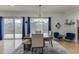 Elegant dining room featuring a modern chandelier and sliding glass doors to the deck at 5995 Lanier Heights Cir, Buford, GA 30518