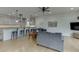 Cozy living space featuring a comfortable sofas with kitchen and bar seating in the background at 5995 Lanier Heights Cir, Buford, GA 30518
