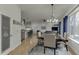 Open-concept living space with dining area, kitchen, and a view to the outside at 5995 Lanier Heights Cir, Buford, GA 30518