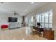 Open living room with a large TV, comfortable seating, and natural light from surrounding windows at 5995 Lanier Heights Cir, Buford, GA 30518