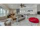 Open concept living area with bar, lounge area, and access to the outdoors at 5995 Lanier Heights Cir, Buford, GA 30518