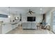 Spacious living area with comfortable seating, fireplace and bar with barstool seating at 5995 Lanier Heights Cir, Buford, GA 30518