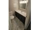 Well lit bathroom featuring a large vanity with generous counter space and a toilet at 2172 Nancy Way, Loganville, GA 30052