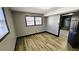 Comfortable bedroom with wood-look flooring, natural light, and a calming atmosphere for rest and relaxation at 2172 Nancy Way, Loganville, GA 30052