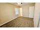 Neutral bedroom featuring carpet, a ceiling fan, and natural light from one window at 2172 Nancy Way, Loganville, GA 30052