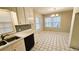 Well-lit kitchen with white cabinetry, stylish backsplash, and a breakfast nook perfect for casual dining at 2172 Nancy Way, Loganville, GA 30052