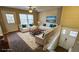 Staged living room with white seating, a decorative rug, and a back deck view for relaxation and entertainment at 2172 Nancy Way, Loganville, GA 30052