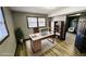 This is a bright and modern home office with wood floors and a decorative rug at 2172 Nancy Way, Loganville, GA 30052