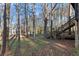 The property features a wooded backyard with mature trees, providing a secluded feel at 3171 Jessica Dr, Douglasville, GA 30135