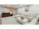 Finished basement with a comfortable sectional sofa, modern decor, and custom wooden staircase at 3171 Jessica Dr, Douglasville, GA 30135