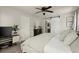 Comfortable bedroom featuring a ceiling fan and stylish sliding barn door to a walk-in closet at 3171 Jessica Dr, Douglasville, GA 30135