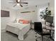 Bright bedroom featuring a ceiling fan and a convenient desk area with a modern computer setup at 3171 Jessica Dr, Douglasville, GA 30135