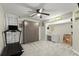 Bedroom featuring a ceiling fan, closet with storage, a desk area, and a treadmill at 3171 Jessica Dr, Douglasville, GA 30135