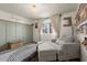 Cozy bedroom with seating area, a decorative wall, and a window with natural light at 3171 Jessica Dr, Douglasville, GA 30135