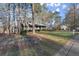 Charming ranch-style home with a covered porch, white railings, and well-maintained landscaping at 3171 Jessica Dr, Douglasville, GA 30135