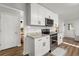 Bright kitchen features stainless steel appliances, granite countertops and white cabinetry at 3171 Jessica Dr, Douglasville, GA 30135