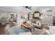 Open-concept living room features a ceiling fan and a comfortable seating arrangement at 3171 Jessica Dr, Douglasville, GA 30135