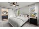 Serene main bedroom with barn door to bathroom, two windows and neutral color palette at 3171 Jessica Dr, Douglasville, GA 30135