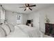 Comfortable main bedroom with ample natural light, neutral color palette, and ceiling fan at 3171 Jessica Dr, Douglasville, GA 30135