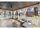 Relaxing screened-in porch with wicker furniture and outdoor lights at 3171 Jessica Dr, Douglasville, GA 30135