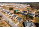 Aerial view of a residential community featuring tennis courts and a pool at 3475 Summerlin Pkwy, Lithia Springs, GA 30122