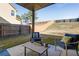 Spacious backyard featuring a patio seating area and a well-maintained lawn at 3475 Summerlin Pkwy, Lithia Springs, GA 30122