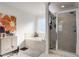 Bathroom featuring a soaking tub, tiled shower, decorative art, and a large sunny window at 3475 Summerlin Pkwy, Lithia Springs, GA 30122
