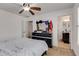 Bedroom featuring neutral walls, ceiling fan, carpeted floor, and an adjacent bathroom at 3475 Summerlin Pkwy, Lithia Springs, GA 30122