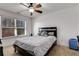 Comfortable bedroom with a bed, ceiling fan, and a bright window at 3475 Summerlin Pkwy, Lithia Springs, GA 30122