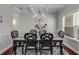 Elegant dining room featuring a coffered ceiling, stylish chandelier, and seating for six at 3475 Summerlin Pkwy, Lithia Springs, GA 30122